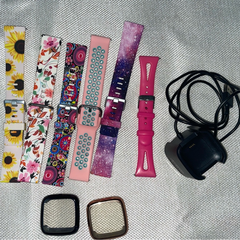 Lot of FitBit Versa 2 bands (6), case covers (7) and charger